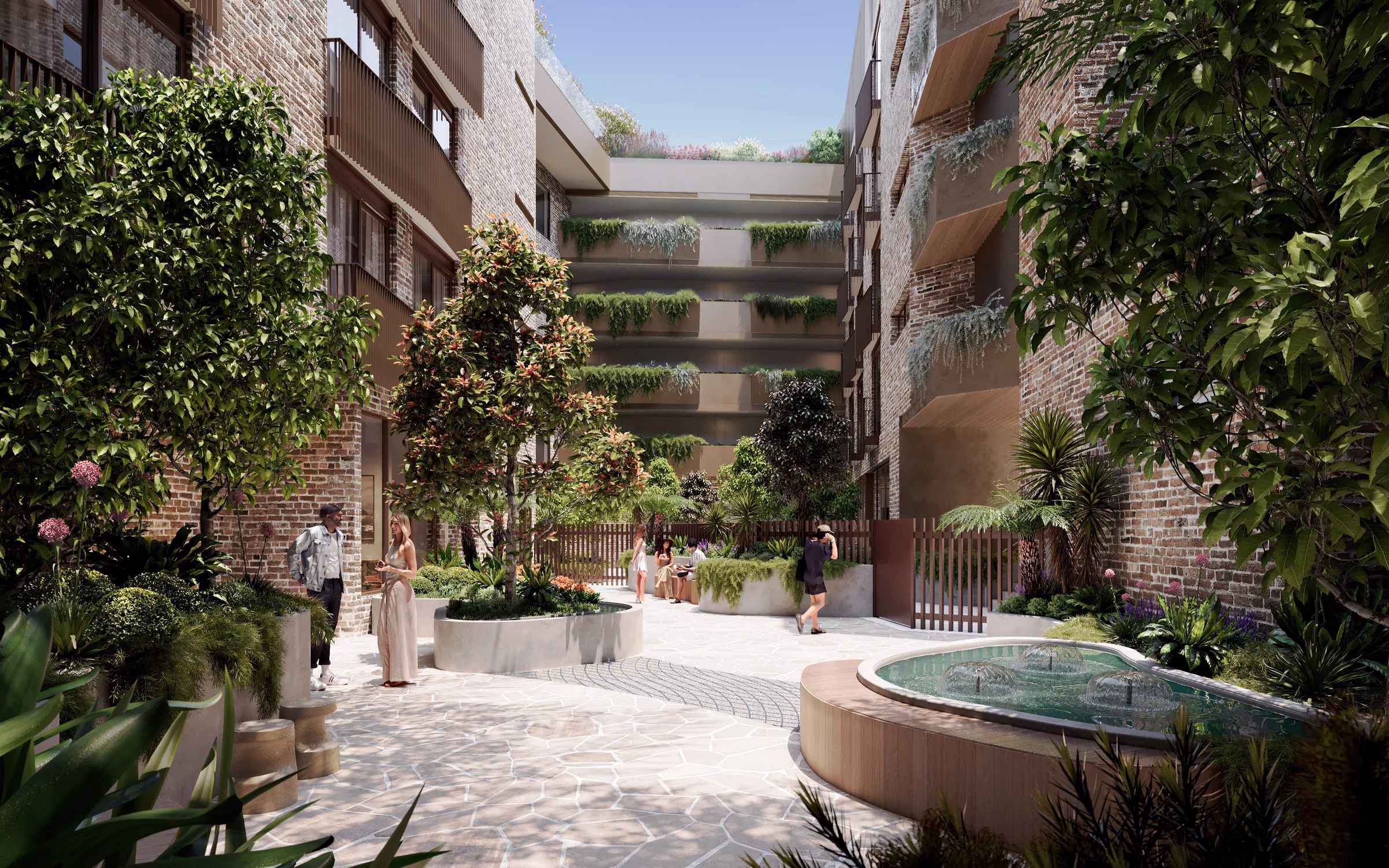 CGI by Binyan Studios of Scape Eveleigh’s landscaped communal courtyard, with brick walls, seating and a water feature