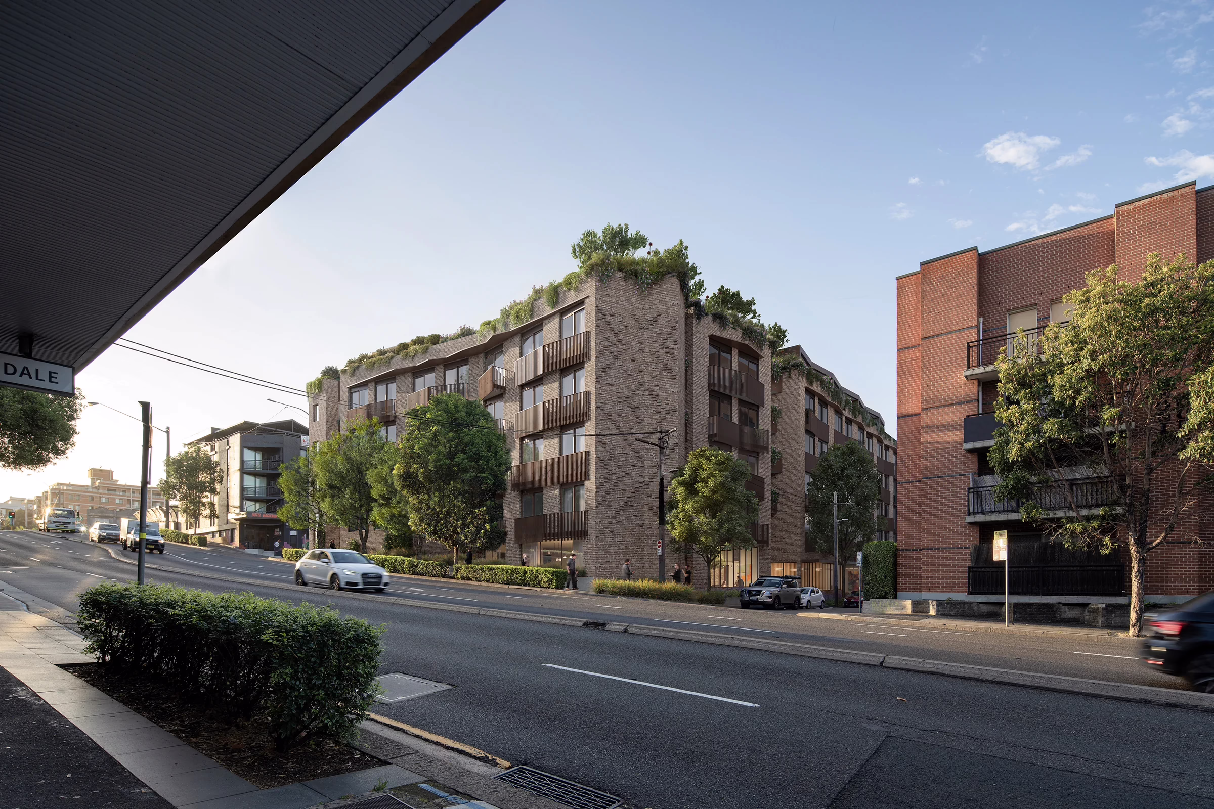 CGI by Binyan Studios of Scape Eveleigh at the Cleveland and Woodburn Street corner, with articulated brickwork and planted roof terraces